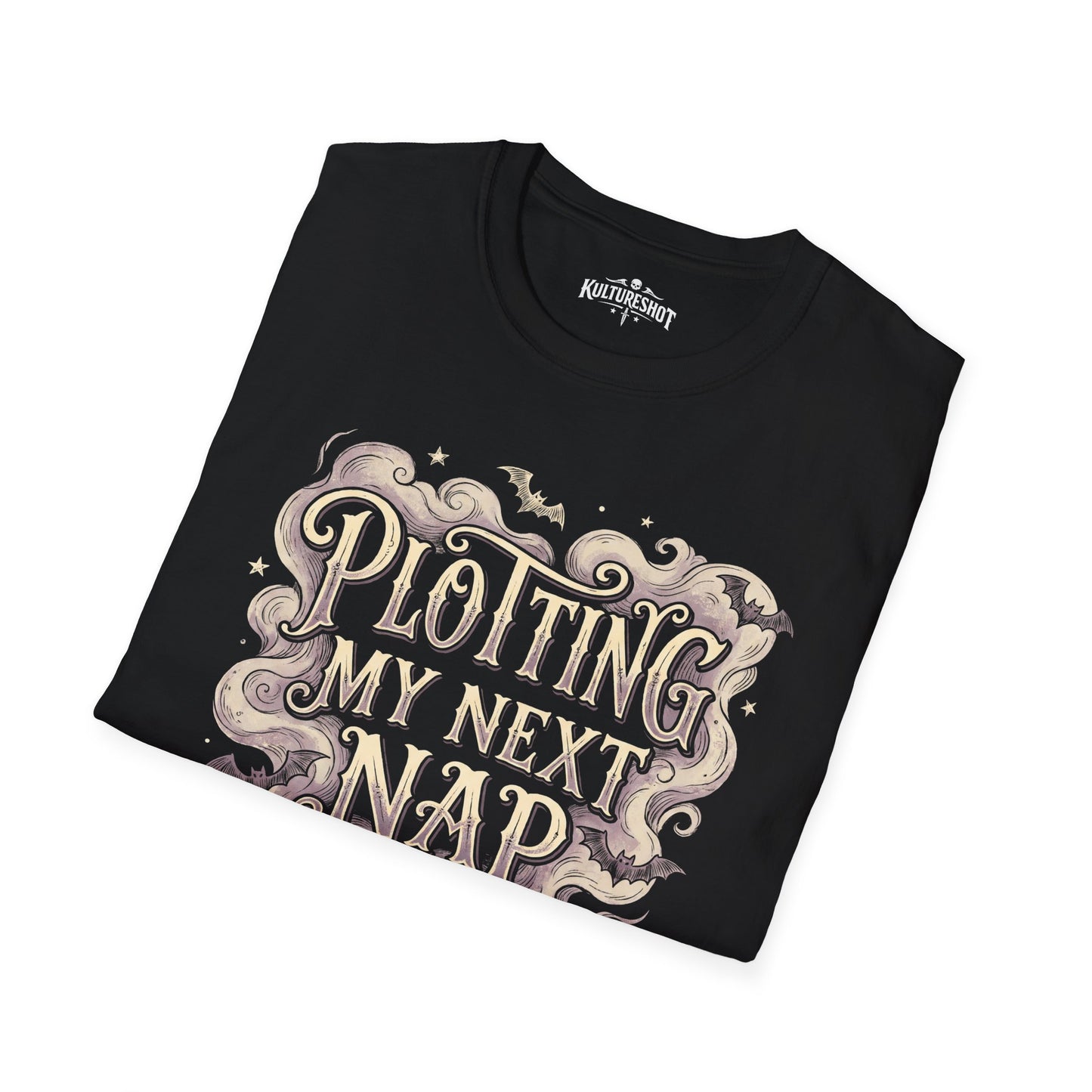 Folded black shirt with decorative text design on a white background