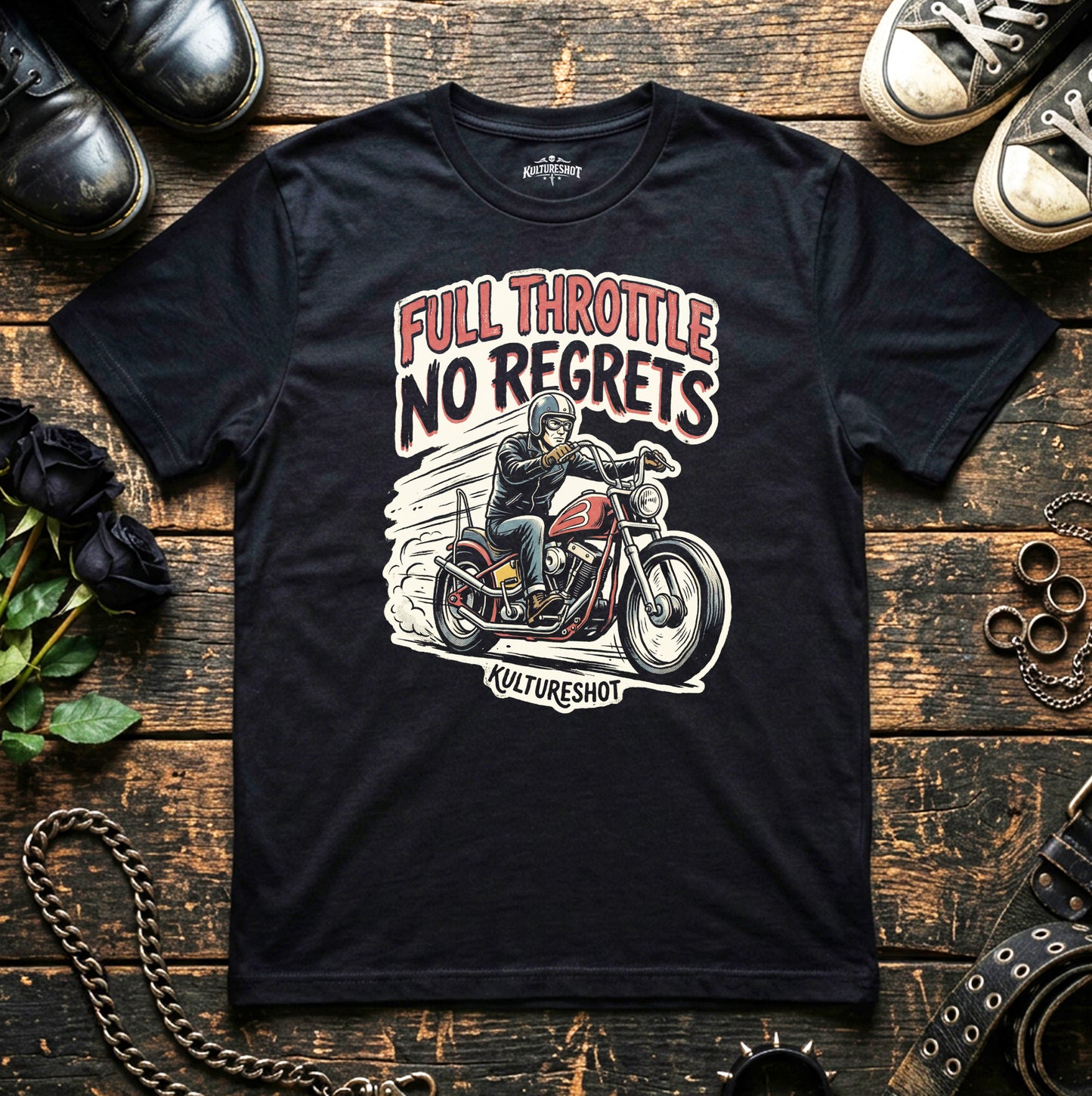 Black t-shirt with a motorcycle graphic and text 'Full Throttle No Regrets' on a wooden surface with shoes and a chain.