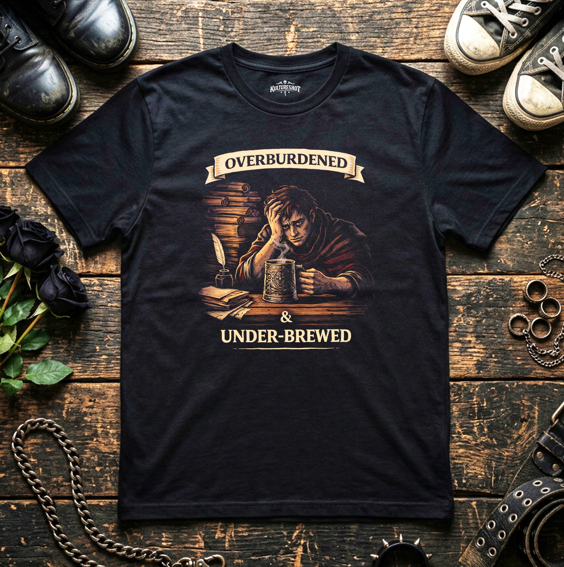 Black t-shirt with graphic design on a wooden surface.