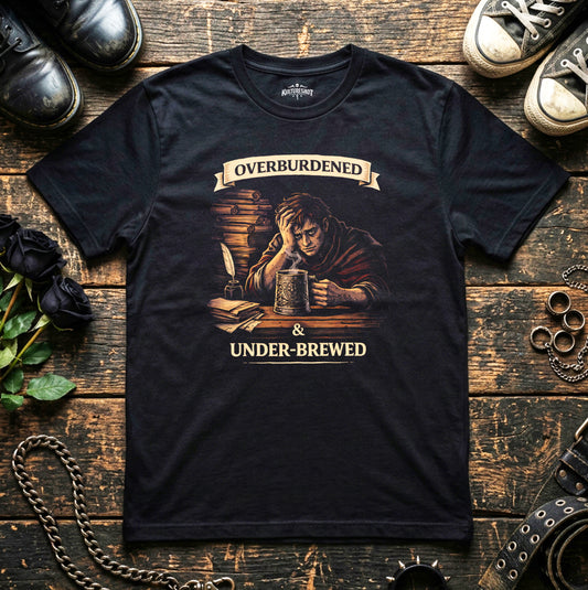 Black t-shirt with graphic design on a wooden surface.