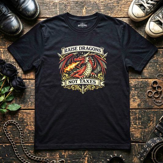 Black t-shirt with dragon graphic and text on a wooden surface with shoes and jewelry.
