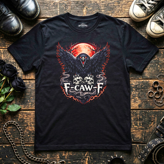 Black t-shirt with a graphic design featuring a crow and text on a wooden surface with shoes and chains.