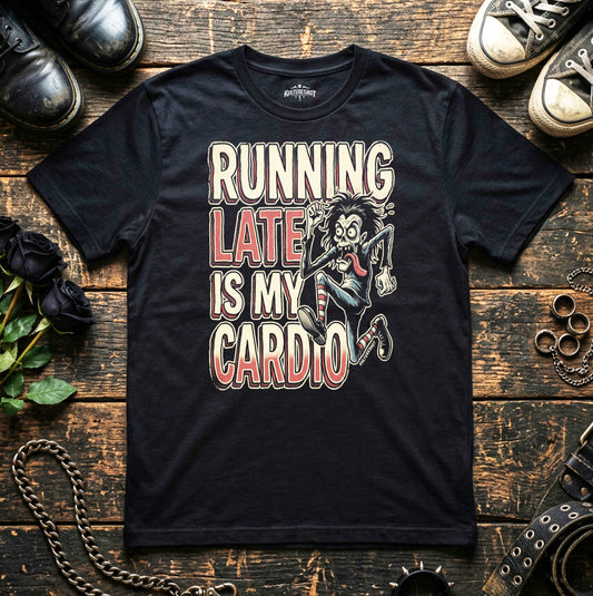 Black t-shirt with graphic design and text on a wooden surface with shoes and accessories.