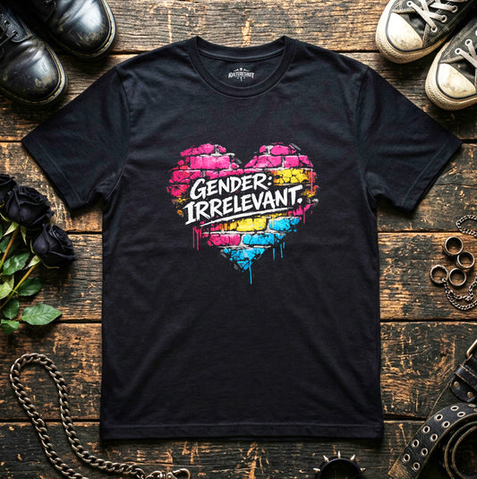 Black t-shirt with colorful heart design and 'Gender: Irrelevant' text on a wooden surface with shoes and flowers.