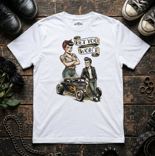 White t-shirt with a graphic design of a couple and a car on a wooden surface