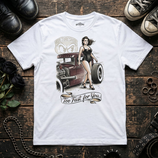 White t-shirt with a graphic design of a woman next to a hot rod on a wooden surface.