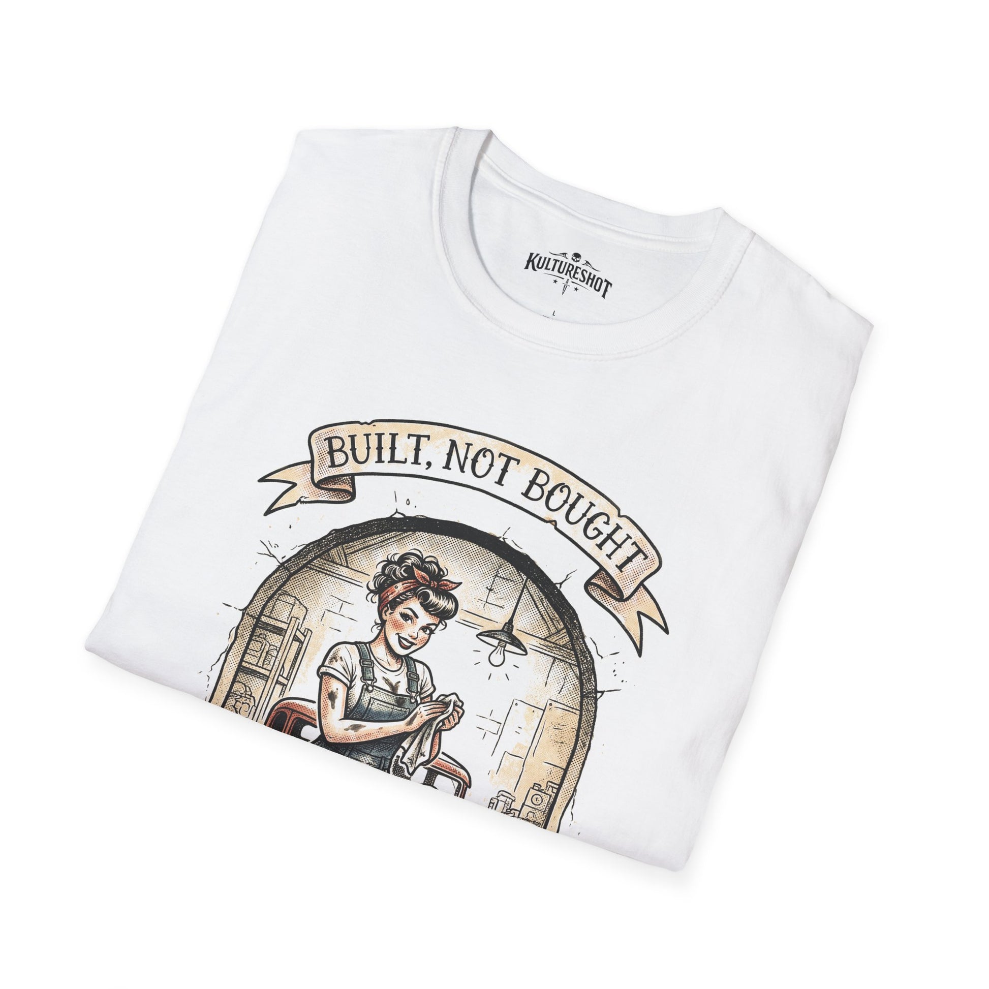 White t-shirt with a graphic design of a woman and text 'Built, Not Bought' on a white background.