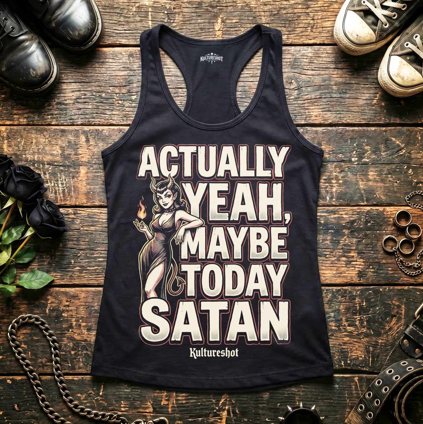 Black tank top with graphic design and text on a wooden surface with shoes and roses.