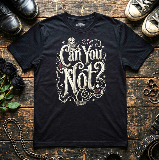Black t-shirt with 'Can You Not?' design on a wooden surface with shoes and chains.