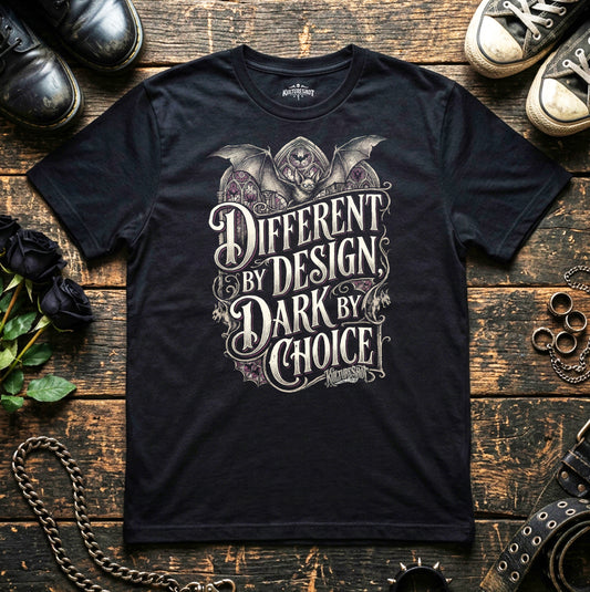 Black t-shirt with graphic design and text on a wooden surface with shoes and accessories.